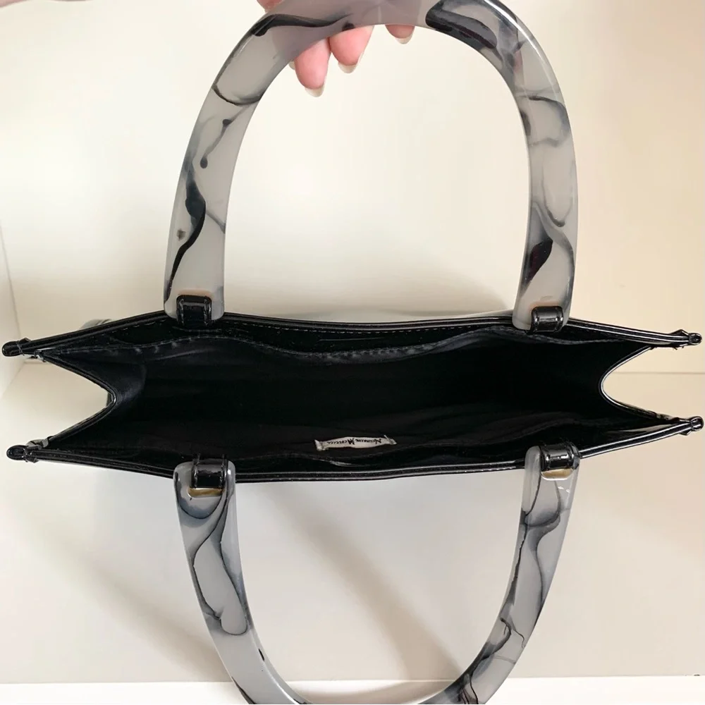 Hold NWOT Neiman Marcus black patent marble handle modern bag